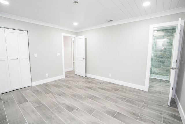 913 Spindle Palm Way, Apollo Beach, FL 33572 - unfurnished bedroom with recessed lighting, ornamental molding, a closet, baseboards, and light wood-style floors