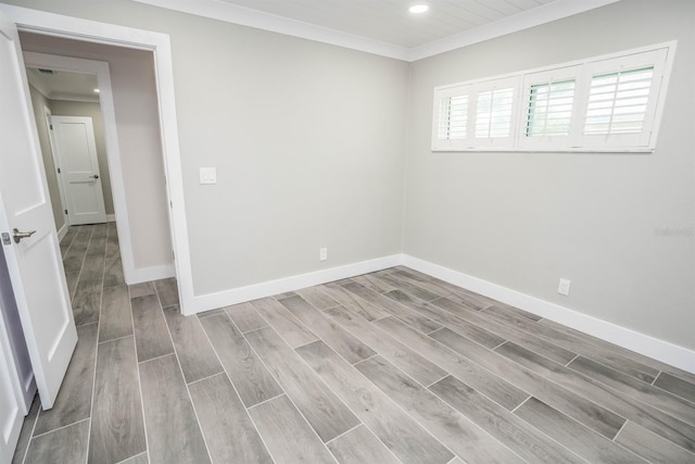 913 Spindle Palm Way, Apollo Beach, FL 33572 - unfurnished room with wood finished floors, recessed lighting, baseboards, and crown molding