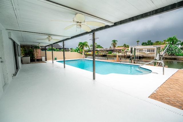 913 Spindle Palm Way, Apollo Beach, FL 33572 - swimming pool with a ceiling fan, a patio area, boat lift, and a water view