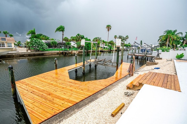 913 Spindle Palm Way, Apollo Beach, FL 33572 - dock featuring boat lift and a water view