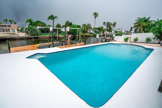 913 Spindle Palm Way, Apollo Beach, FL 33572 - view of pool featuring boat lift, a boat dock, and a water view