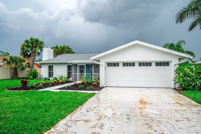 913 Spindle Palm Way, Apollo Beach, FL 33572 - single story home featuring a front yard, concrete driveway, a garage, a chimney, and stucco siding