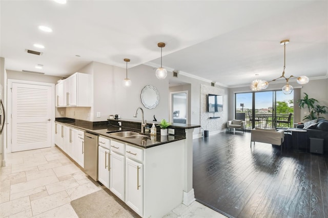 1108 N Franklin St Unit 502, Tampa, FL 33602 - kitchen with a sink, stainless steel dishwasher, a peninsula, open floor plan, and dark countertops