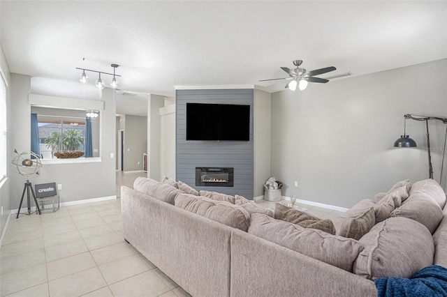 1135 Millbrook Cir, Bradenton, FL 34212 - living room featuring ceiling fan, light tile patterned floors, and a fireplace