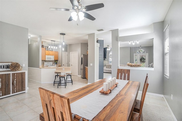1135 Millbrook Cir, Bradenton, FL 34212 - dining room featuring light tile patterned flooring and ceiling fan