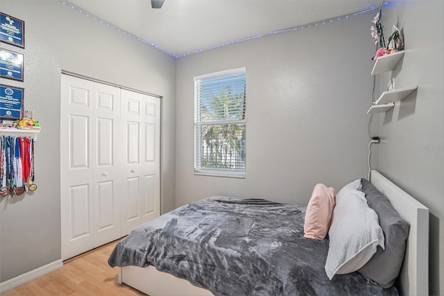 1135 Millbrook Cir, Bradenton, FL 34212 - bedroom with wood finished floors, a closet, and ceiling fan