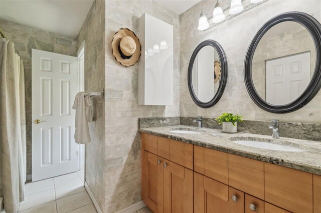 18914 Geraci Rd, Lutz, FL 33548 - bathroom featuring double vanity, tile patterned flooring, and tile walls
