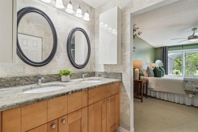 18914 Geraci Rd, Lutz, FL 33548 - bathroom featuring ensuite bath, double vanity, ceiling fan, and a textured ceiling