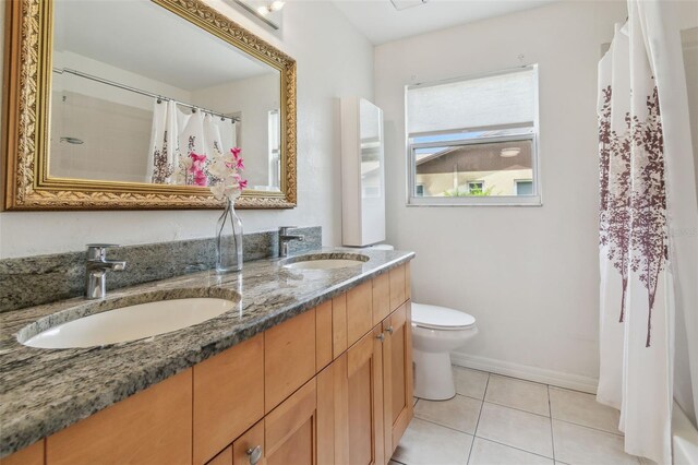 18914 Geraci Rd, Lutz, FL 33548 - full bath featuring double vanity, tile patterned floors, and curtained shower
