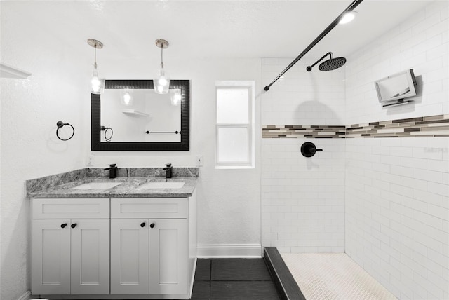 3906 W Rogers Ave, Tampa, FL 33611 - full bathroom featuring tiled shower, double vanity, baseboards, and tile patterned floors