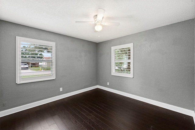 3906 W Rogers Ave, Tampa, FL 33611 - spare room featuring dark wood-style flooring, a ceiling fan, baseboards, and a textured wall