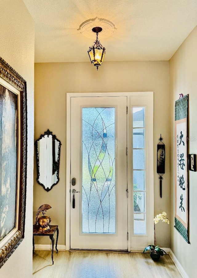 5103 98th Ave E, Parrish, FL 34219 - foyer entrance with wood finished floors and baseboards