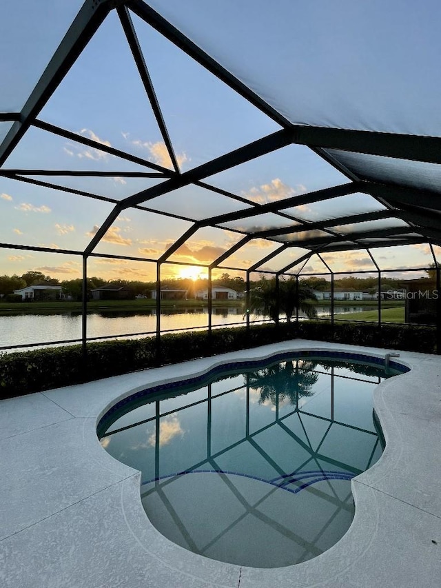 5103 98th Ave E, Parrish, FL 34219 - swimming pool with a water view, glass enclosure, and a patio area