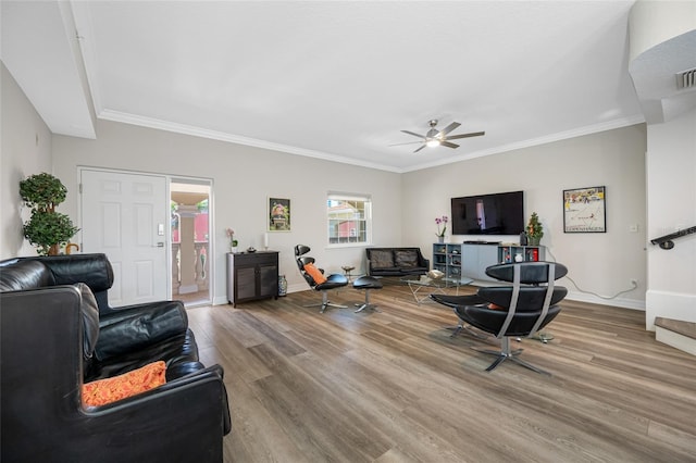 340 1st St N Unit I, Saint Petersburg, FL 33701 - living area featuring wood finished floors, a ceiling fan, baseboards, and crown molding