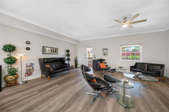 340 1st St N Unit I, Saint Petersburg, FL 33701 - living area with wood finished floors, healthy amount of natural light, ornamental molding, and baseboards