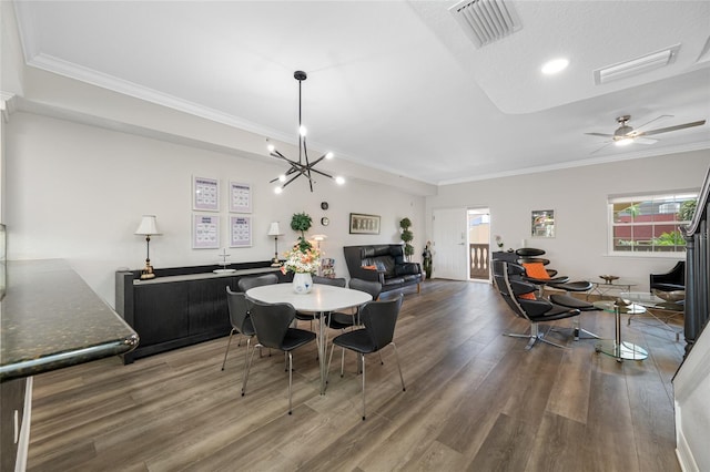 340 1st St N Unit I, Saint Petersburg, FL 33701 - dining space with wood finished floors, crown molding, a chandelier, baseboards, and recessed lighting