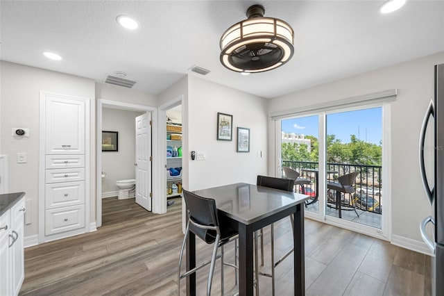 340 1st St N Unit I, Saint Petersburg, FL 33701 - dining room with light wood-type flooring, recessed lighting, and baseboards