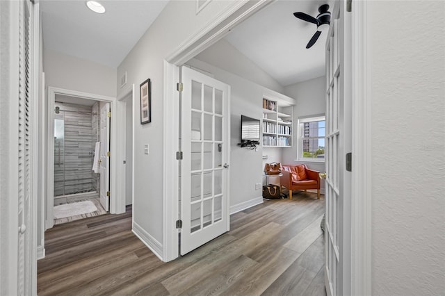 340 1st St N Unit I, Saint Petersburg, FL 33701 - hallway with wood finished floors and lofted ceiling