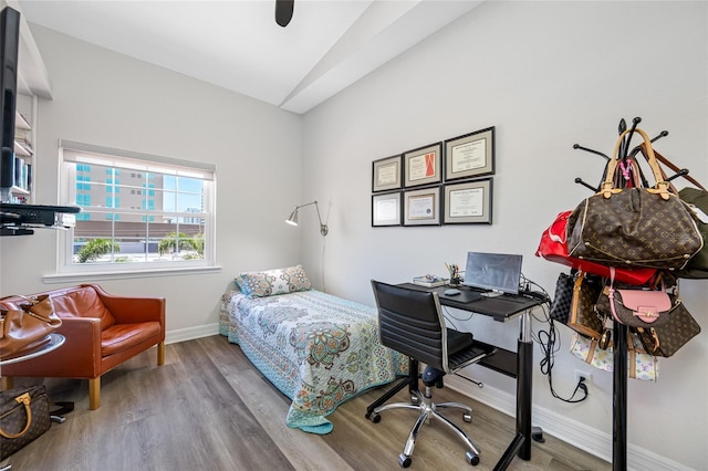 340 1st St N Unit I, Saint Petersburg, FL 33701 - bedroom with wood finished floors, baseboards, lofted ceiling, an office area, and ceiling fan
