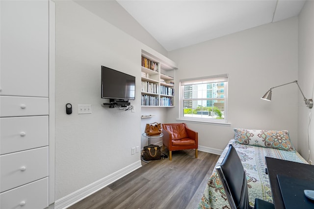 340 1st St N Unit I, Saint Petersburg, FL 33701 - bedroom featuring wood finished floors, baseboards, and vaulted ceiling
