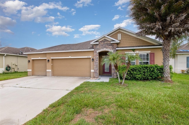 view of front of house featuring concrete driveway, a garage, a front yard, and stucco siding