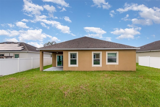 back of house featuring stucco siding, a patio, a fenced backyard, and a shingled roof