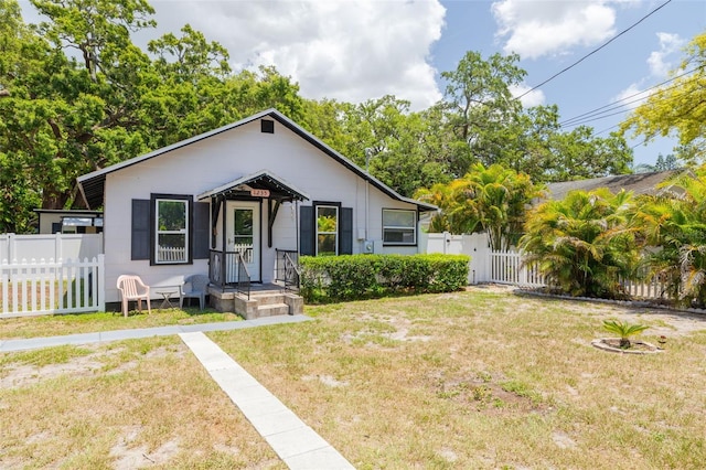 1235 Bass Blvd, Dunedin, FL 34698 - bungalow-style house with a gate