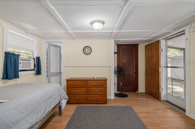 1235 Bass Blvd, Dunedin, FL 34698 - bedroom with light wood-type flooring and cooling unit
