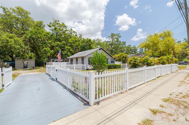 1235 Bass Blvd, Dunedin, FL 34698 - view of front of home featuring a fenced front yard
