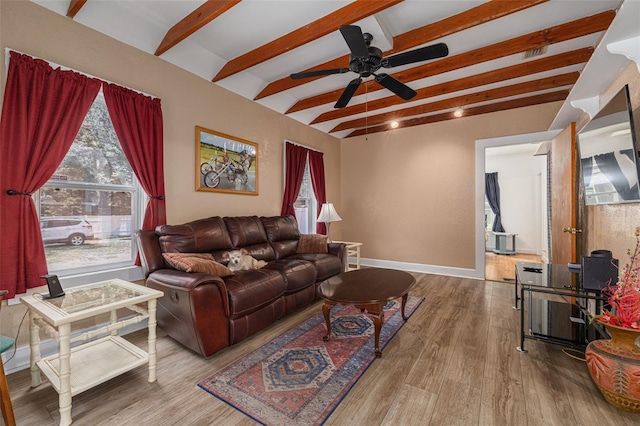 1235 Bass Blvd, Dunedin, FL 34698 - living area featuring beamed ceiling, wood finished floors, a ceiling fan, and baseboards