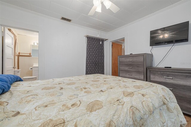1235 Bass Blvd, Dunedin, FL 34698 - bedroom featuring ornamental molding, connected bathroom, and a ceiling fan
