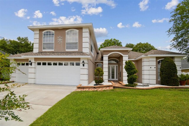 1460 Kensington Woods Dr, Lutz, FL 33549 - view of front of property with concrete driveway, an attached garage, a front lawn, stucco siding, and roof with shingles