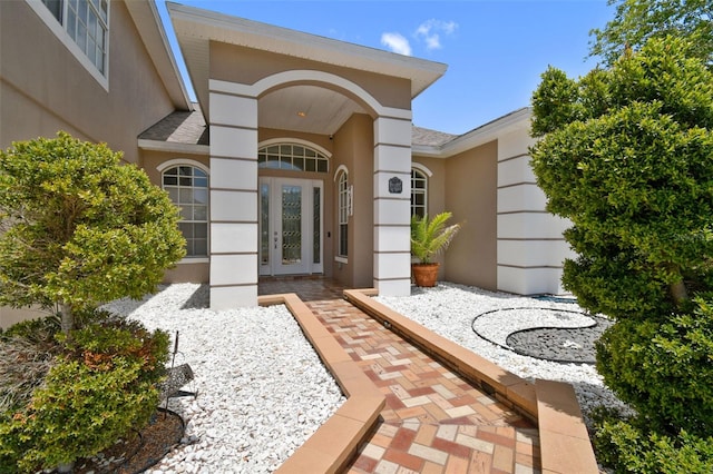 1460 Kensington Woods Dr, Lutz, FL 33549 - doorway to property featuring stucco siding and french doors