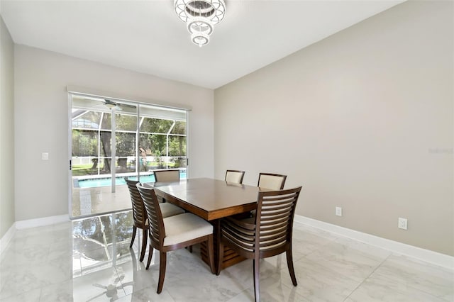 1460 Kensington Woods Dr, Lutz, FL 33549 - dining room featuring light marble finish flooring and a sunroom
