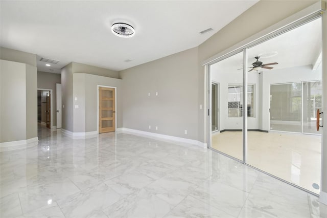 1460 Kensington Woods Dr, Lutz, FL 33549 - empty room featuring light marble finish flooring and a ceiling fan