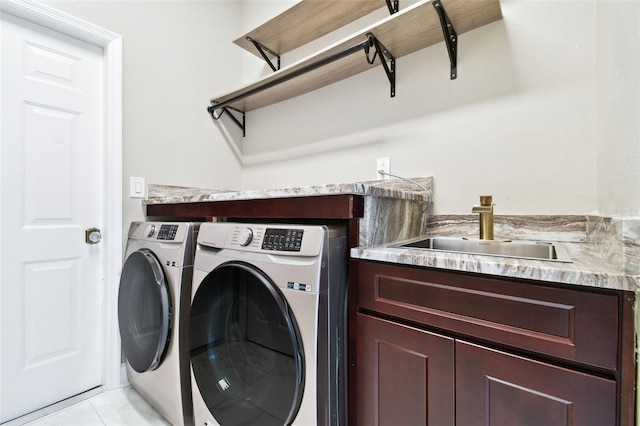 1460 Kensington Woods Dr, Lutz, FL 33549 - laundry area featuring washing machine and clothes dryer and light tile patterned floors