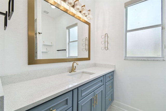 1460 Kensington Woods Dr, Lutz, FL 33549 - bathroom featuring plenty of natural light, vanity, and a chandelier