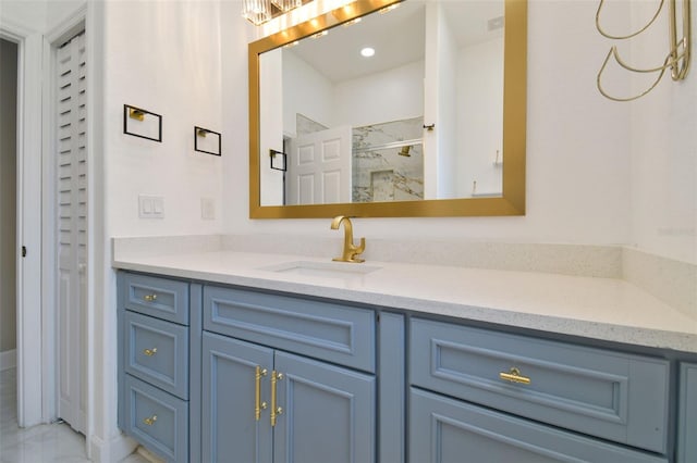 1460 Kensington Woods Dr, Lutz, FL 33549 - bathroom featuring vanity and a marble finish shower