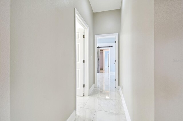 1460 Kensington Woods Dr, Lutz, FL 33549 - hall featuring light marble finish floors and baseboards