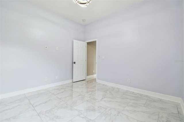 1460 Kensington Woods Dr, Lutz, FL 33549 - unfurnished room with light marble finish floors and baseboards