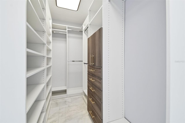 1460 Kensington Woods Dr, Lutz, FL 33549 - walk in closet featuring light marble finish flooring