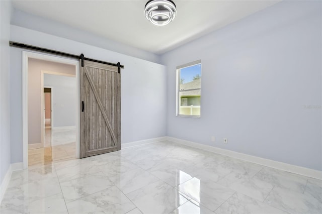 1460 Kensington Woods Dr, Lutz, FL 33549 - spare room with light marble finish flooring and a barn door
