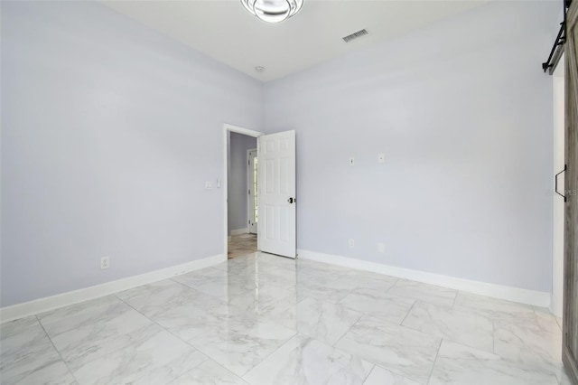1460 Kensington Woods Dr, Lutz, FL 33549 - spare room featuring light marble finish flooring