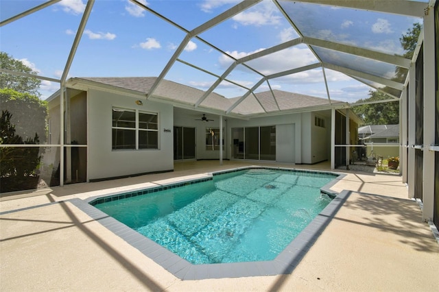 1460 Kensington Woods Dr, Lutz, FL 33549 - outdoor pool with a patio, ceiling fan, and glass enclosure