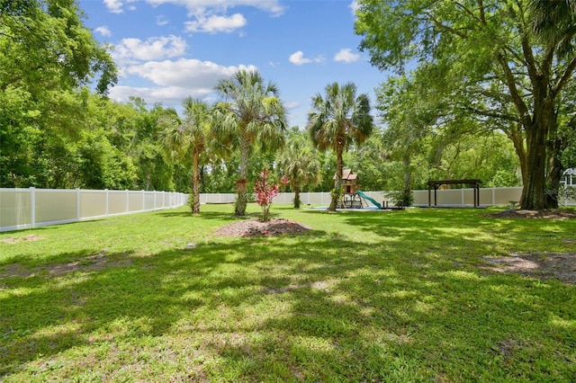 1460 Kensington Woods Dr, Lutz, FL 33549 - fenced backyard featuring a playground