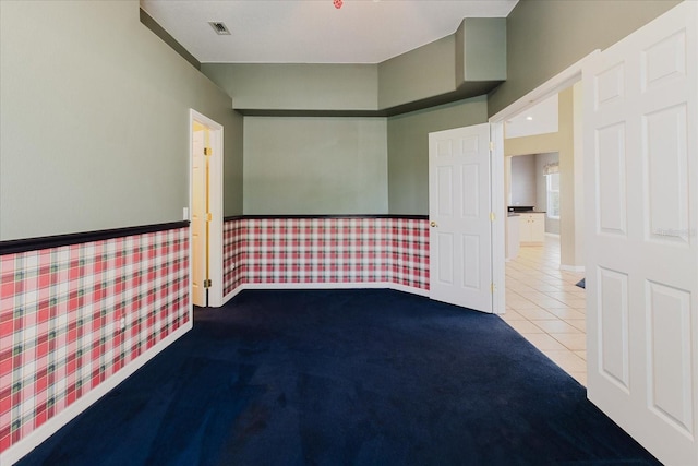1852 Longview Ln, Tarpon Springs, FL 34689 - carpeted spare room featuring tile patterned flooring and baseboards