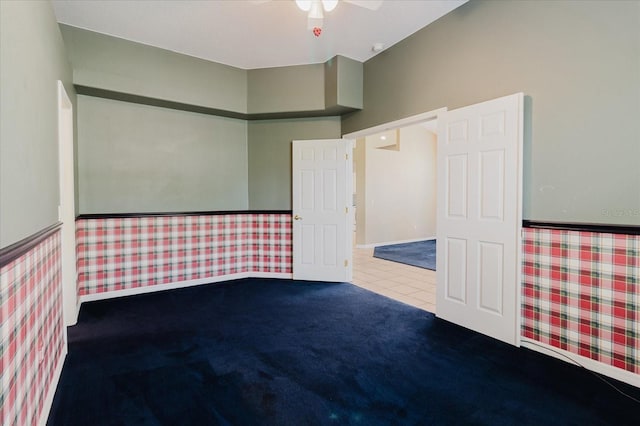 1852 Longview Ln, Tarpon Springs, FL 34689 - empty room featuring carpet, a ceiling fan, and wallpapered walls