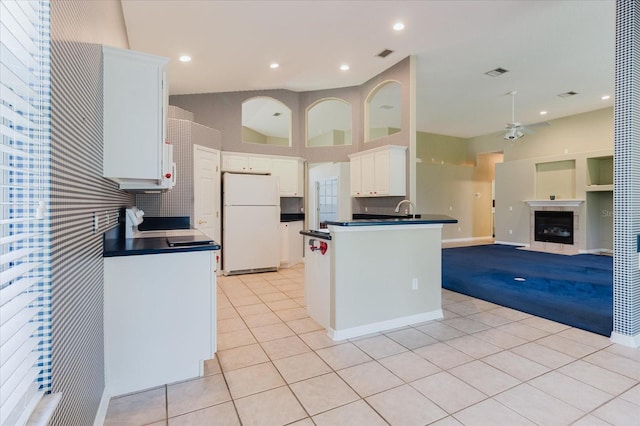 1852 Longview Ln, Tarpon Springs, FL 34689 - kitchen with freestanding refrigerator, dark countertops, open floor plan, ceiling fan, and recessed lighting
