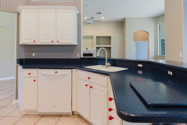 1852 Longview Ln, Tarpon Springs, FL 34689 - kitchen featuring dishwasher, light tile patterned floors, a sink, and dark countertops