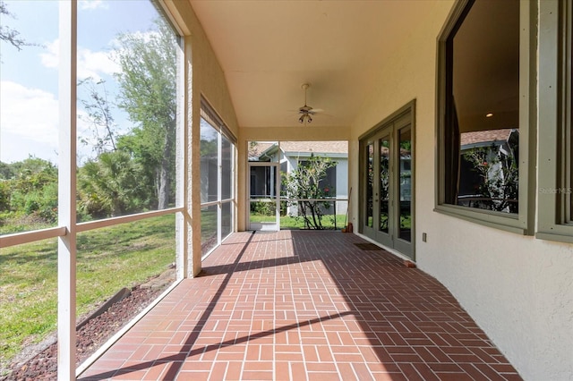 1852 Longview Ln, Tarpon Springs, FL 34689 - unfurnished sunroom featuring french doors and ceiling fan